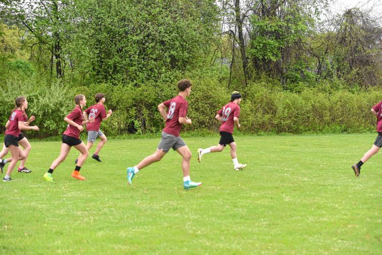 The Academy of Charlemont ultimate team makes its way up the field in the Four Rivers Ultimate Tournament in Greenfield Saturday.