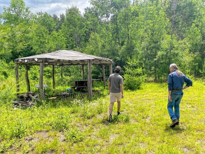 Conway School of Landscape Design student Ben Silverstone and Nolumbeka Project President David Brule at the Wissatinnewag site in Greenfield where a gazebo has been built.