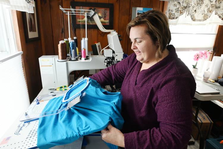 Melissa Murphy of Melissa Murphy Embroidery and Custom Apparel operates one of her embroidering machines in her Bernardston home office.