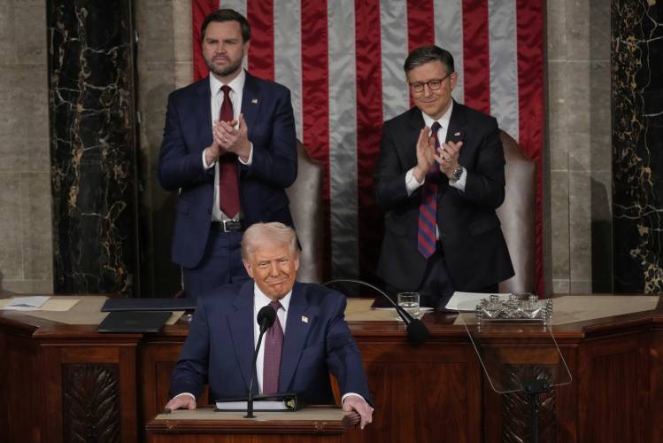 President Donald Trump addresses a joint session of Congress in the House chamber at the U.S. Capitol in Washington, Tuesday, March 4, 2025, as Vice President JD Vance and House Speaker Mike Johnson of La., applaud. (AP Photo/Julia Demaree Nikhinson)