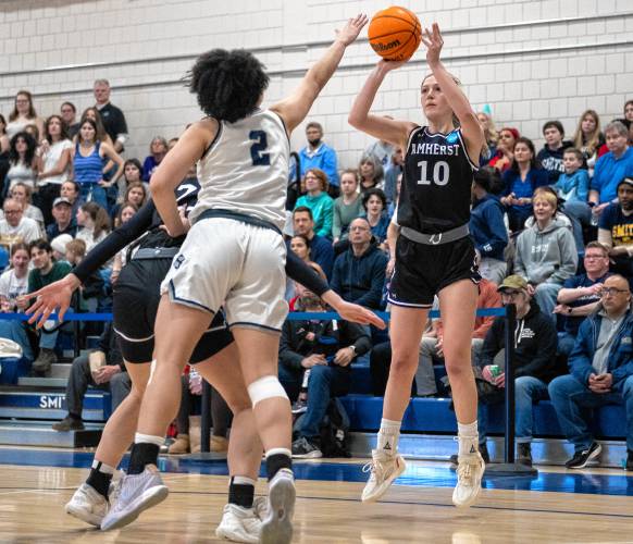 Amherst guard Anna Tranum (10) attempts a shot during the NCAA Division 3 Women's Basketball tournament Round of 32 game against Smith at Ainsworth Gym, Saturday.