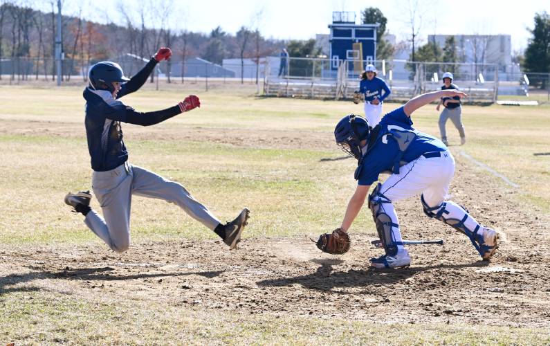 Franklin Tech’s Brody Hicks slides past the tag of Turners Falls catcher Tyler Yetter last week at Franklin Tech. Franklin Tech’s Brody Hicks slides past the tag of Turners Falls catcher Tyler Yetter last week at Franklin Tech.
