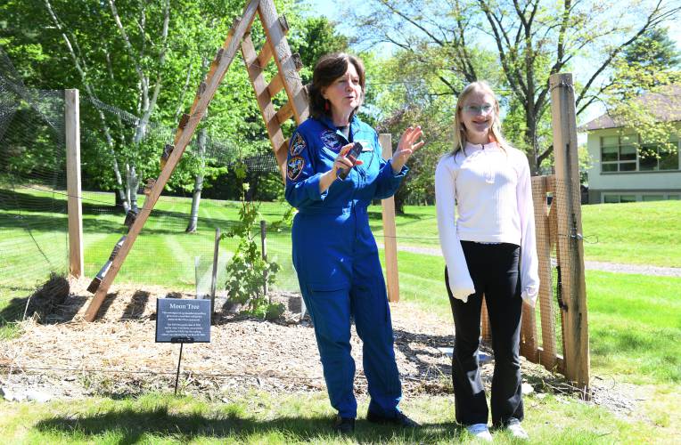 Cady Coleman of Shelburne, a former NASA astronaut, with Amy VanDoren whose efforts brought a Moon Tree to the school, growing behind them.