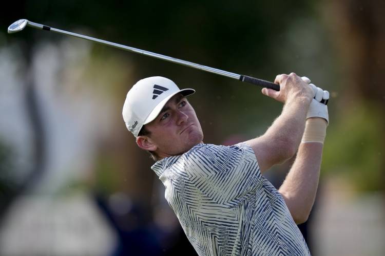 Nick Dunlap watches his tee shot on the fourth hole of the Pete Dye Stadium Course during the final round of the American Express golf tournament, Sunday, Jan. 21, 2024, in La Quinta, Calif. (AP Photo/Ryan Sun)