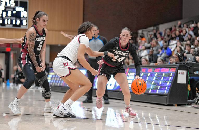 UMass’ Stefanie Kulesza (44) drives against Harvard during the Minutewomen’s season opener on Monday night in Cambridge. UMass’ Stefanie Kulesza (44) drives against Harvard during the Minutewomen’s season opener on Monday night in Cambridge.