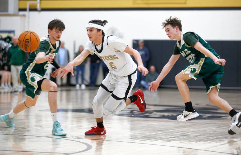 Pioneer’s Alex McClelland (15) chases down a loose ball against Ware in the third quarter of the MIAA Division 5 quarterfinal Friday night in Northfield.