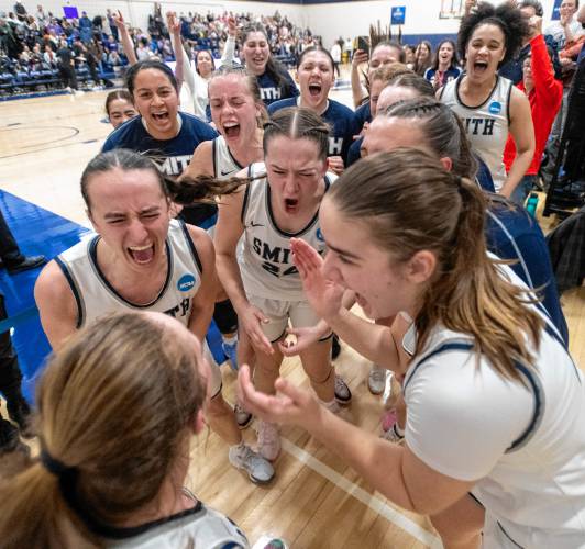 Smith players celebrate after winning the NCAA Division 3 Women's Basketball tournament Round of 32 game against Amherst 52-50 at Ainsworth Gym, Saturday.