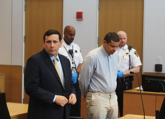 Defense attorney Isaac Mass, left, listens to a prosecutor while standing next to his client, Eric Fenton, in Franklin County Superior Court during sentencing on Friday afternoon.