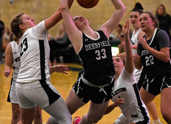 Deerfield Academy’s Charlotte Coody (33) is fouled while putting up a shot in traffic against Williston during NEPSAC action in Deerfield on Wednesday.