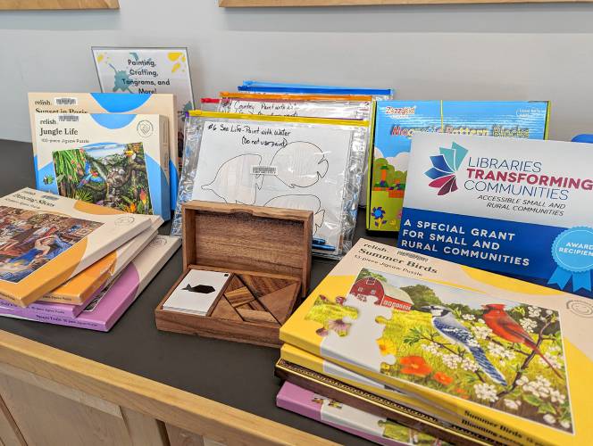 Some Erving Public Library materials that were purchased with the “Libraries Transforming Communities” grant funds that patrons can use in the library and borrow to take home. There are fidget boards for adults, puzzles for a range of abilities, different kinds of coloring sheets, tablets and more.