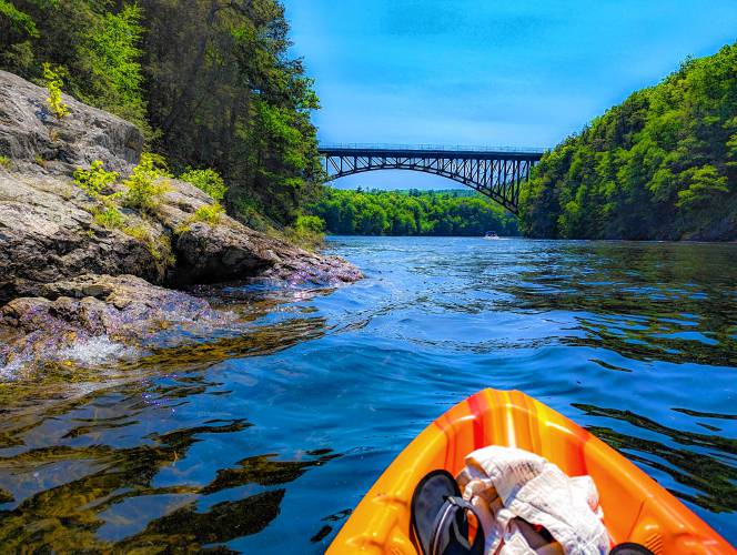 As you paddle downstream from Northfield to Barton Cove, the French King Bridge looms dramatically ahead, casting its reflection onto the channel. On your left after the bridge, you’ll see a slim rocky point where the Millers River joins the Connecticut.