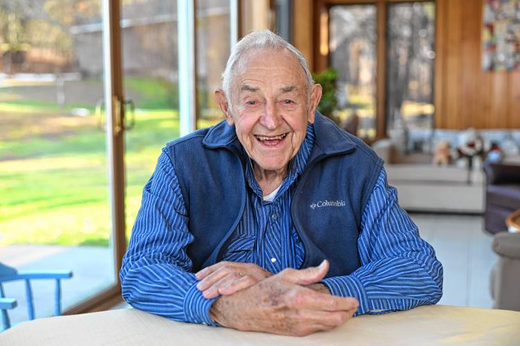 Russell Deane, 96, sits in the sunroom of his Bernardston home.