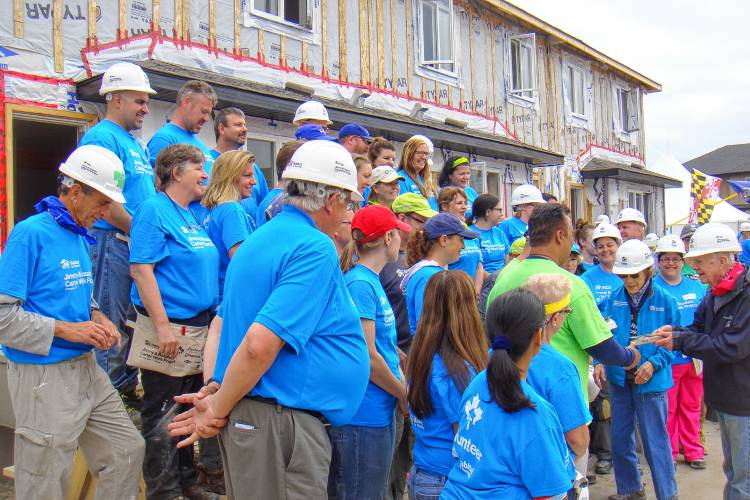 Former Pioneer Valley Habitat for Humanity executive director, MJ Adams, third from left, with volunteers and Jimmy and Rosalynn Carter at a work build in Edmonton, Alberta.