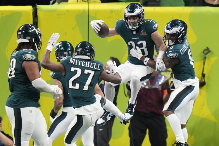 Philadelphia Eagles defensive back Cooper DeJean (33) celebrate his touchdown with safety C.J. Gardner-Johnson (8) after an interception against the Kansas City Chiefs during the first half of the NFL Super Bowl 59 football game, Sunday, Feb. 9, 2025, in New Orleans. (AP Photo/Frank Franklin II)