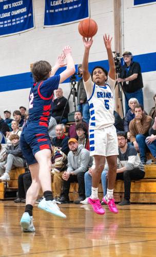 Granby's Gavier Fernandez (5) attempts a three-point shot during the PVIAC Class C tournament semifinal game against Mahar at Granby High School, Tuesday, Feb. 18, 2025, in Granby.