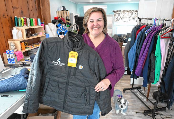Melissa Murphy of Melissa Murphy Embroidery and Custom Apparel in her Bernardston home office with her dog Molly.