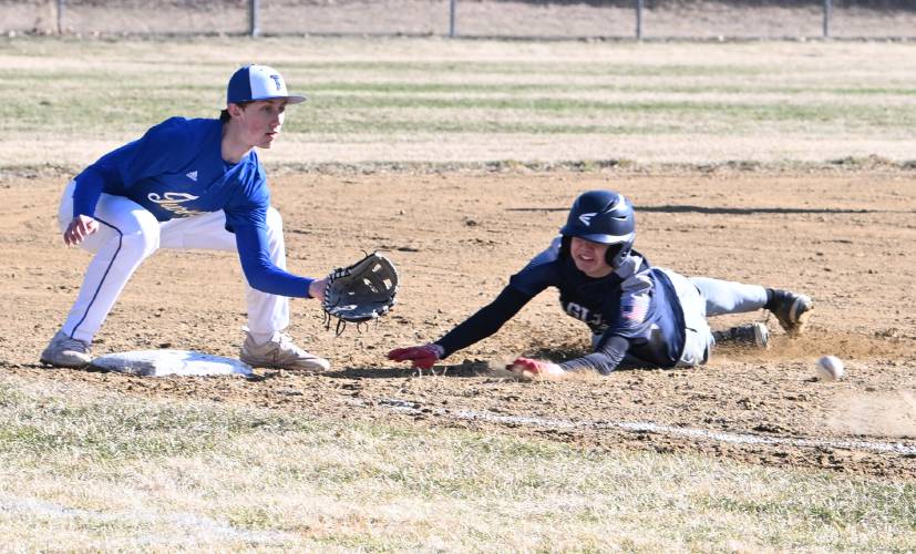Franklin Tech’s Brody Hicks slides into third as Turners Falls’ Nathaniel Trinque tries to gather the throw at Franklin Tech on Tuesday. 