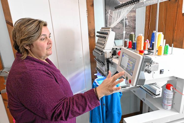 Melissa Murphy of Melissa Murphy Embroidery and Custom Apparel operates one of her embroidering machines in her Bernardston home office.