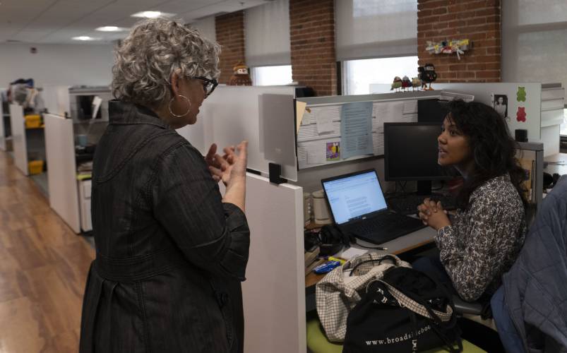 Jill Kaufman, a reporter with New England Public Media, edits a story with Nirvani Williams in Springfield on Wednesday.