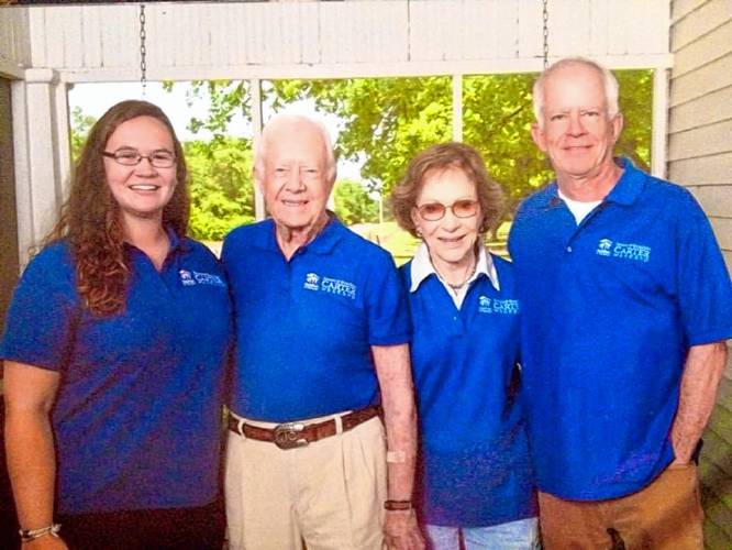 Former Pioneer Valley Habitat for Humanity staff member Amanda Hanley of Sunderland, at left, with Jimmy and Rosalynn Carter.