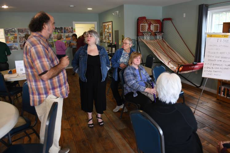 South County Senior Center Director Jennifer Ferrara talks with people at the Senior Center’s current location in Sunderland. As the Senior Center’s feasibility study moves forward, residents of its member towns are invited to a series of public forums to learn about the options being considered for a future home for the center and provide feedback. South County Senior Center Director Jennifer Ferrara talks with people at the Senior Center’s current location in Sunderland. As the Senior Center’s feasibility study moves forward, residents of its member towns are invited to a series of public forums to learn about the options being considered for a future home for the center and provide feedback.