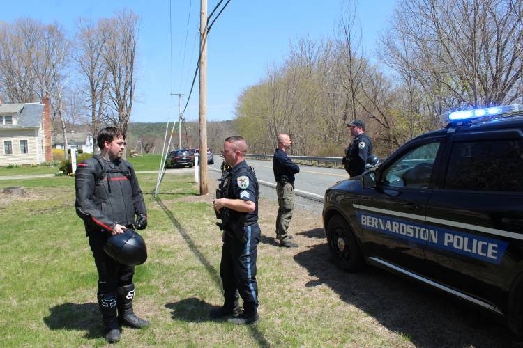 Bernardston Police talk to a motorcyclist after his fellow rider was injured in a crash, caused by mechanical failure, on Brattleboro Road (Route 5) on Thursday. Bernardston Police talk to a motorcyclist after his fellow rider was injured in a crash, caused by mechanical failure, on Brattleboro Road (Route 5) on Thursday.