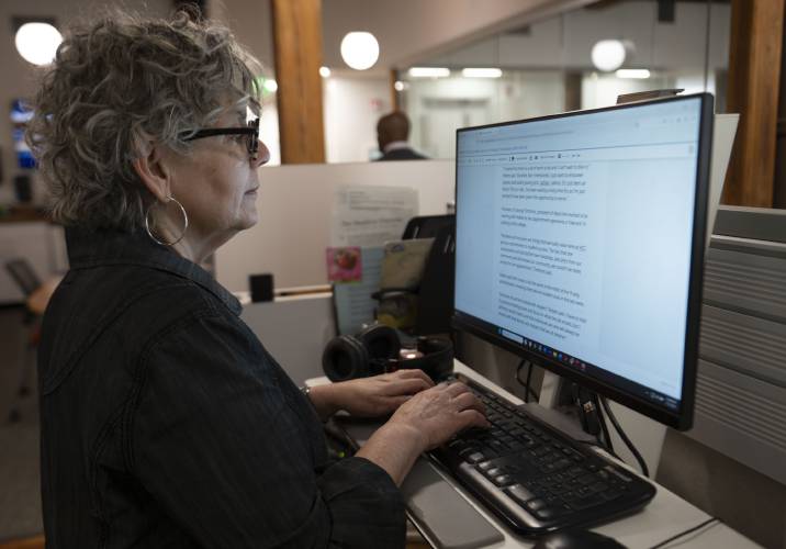 Jill Kaufman, a reporter with New England Public Media, edits a story in Springfield on Wednesday.