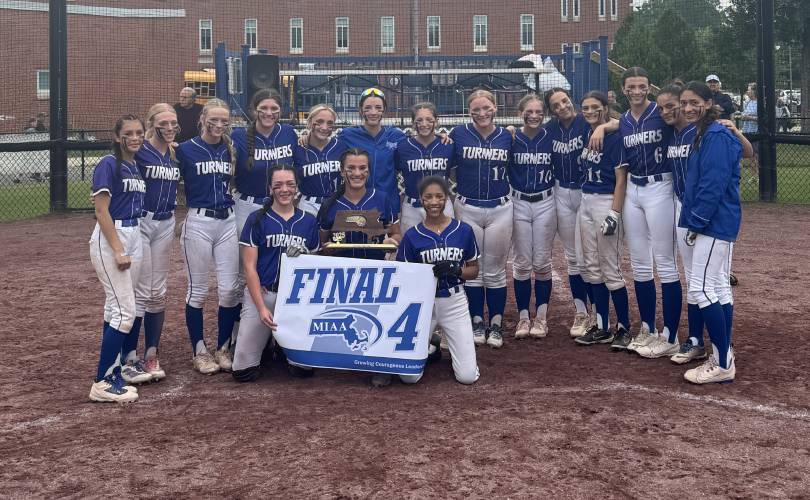 The Turners Falls softball team shows off its Final Four banner after beating Narragansett, 6-3, in the MIAA Division 5 quarterfinal round on Sunday at Gary Mullins Field in Turners Falls.