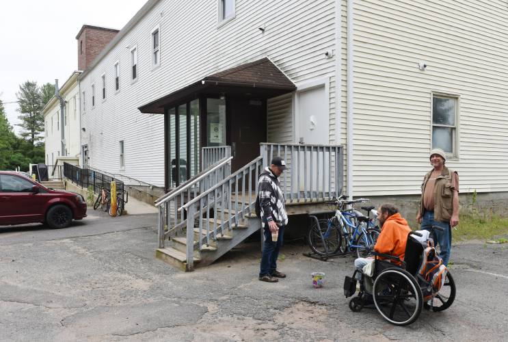 Guests socialize outside the homeless shelter on Wells Street in Greenfield, which is now run by Clinical & Support Options, in June 2022. It was formerly operated by ServiceNet. Guests socialize outside the homeless shelter on Wells Street in Greenfield, which is now run by Clinical & Support Options, in June 2022. It was formerly operated by ServiceNet.