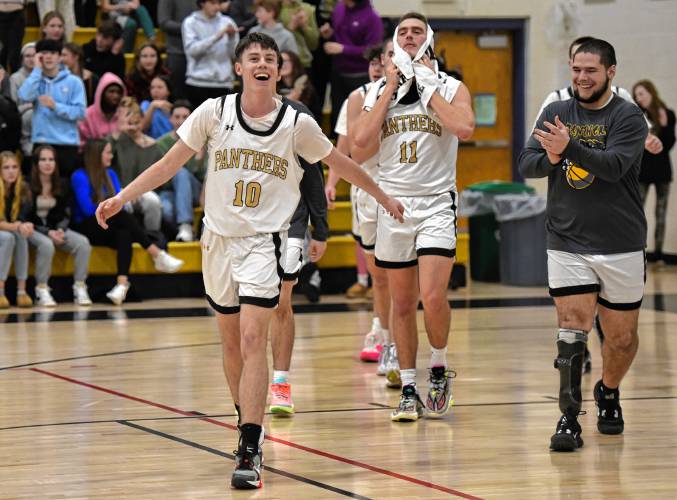 Pioneer’s Brayden Thayer (10) is all smiles after scoring the 1,000th point of his career during the Panthers’ 65-37 win over Fenway in the MIAA Division 5 Round of 32 on Friday night at Messer Gymnasium in Northfield.