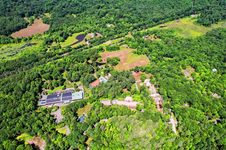 The sprawling Leverett estate built by late Yankee Candle Co. founder Michael J. Kittredge II. The site is bounded by Amherst Road to the east, railroad tracks to the west and Juggler Meadow Road to the north, and extends into Amherst to the south.