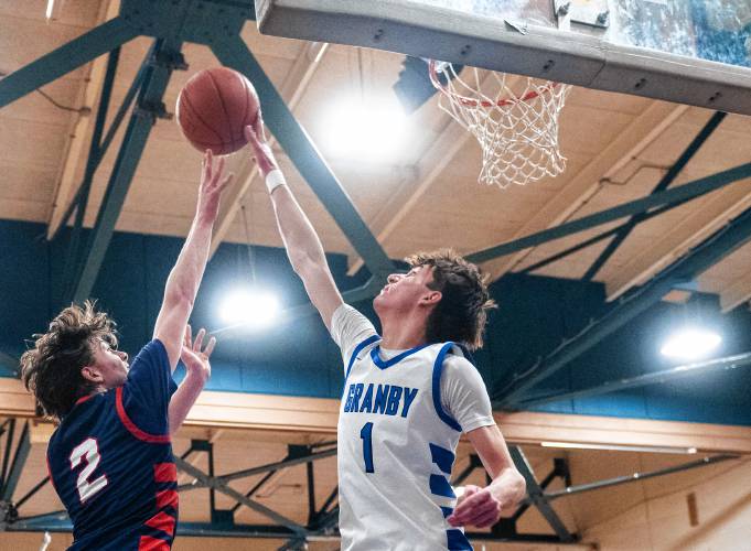 Mahar's Morgan Softic (2) has a shot blocked by Granby's Riley Goodhind (1) during the PVIAC Class C tournament semifinal game at Granby High School, Tuesday, Feb. 18, 2025, in Granby.