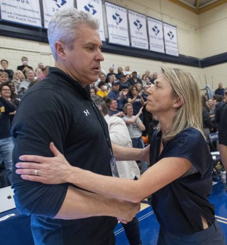Smith Head Coach Lynn Hersey, right, shakes hands with Amherst Head Coach G.P. Gromacki, left, after winning the NCAA Division 3 Women's Basketball tournament Round of 32 game 52-50 at Ainsworth Gym, Saturday.