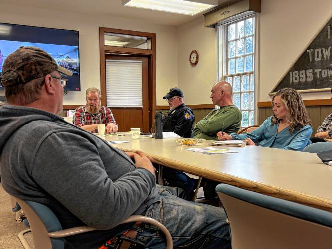 Rowe town officials and members of the public discuss the extended power outage in February during a meeting last week.