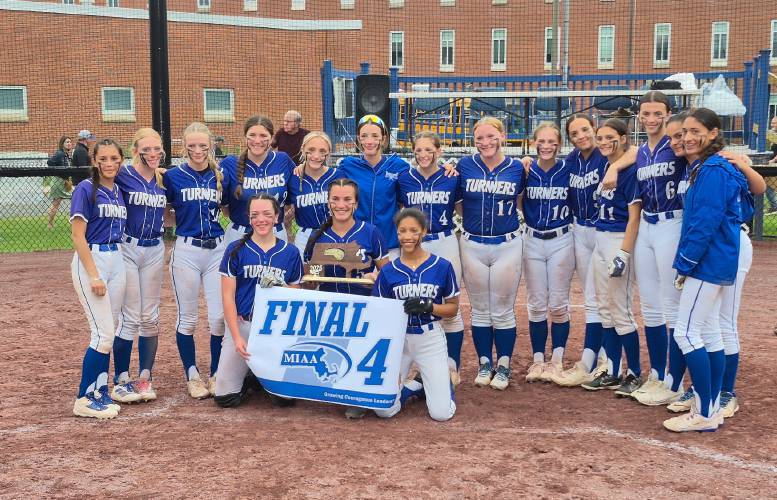 The Turners Falls softball team shows off its Final Four banner after beating Narragansett, 6-3, in the MIAA Division 5 quarterfinal round on Sunday at Gary Mullins Field in Turners Falls.
