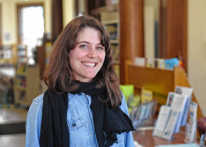 Montague Public Libraries Director Caitlin Kelley, pictured in Carnegie Public Library in Turners Falls. 