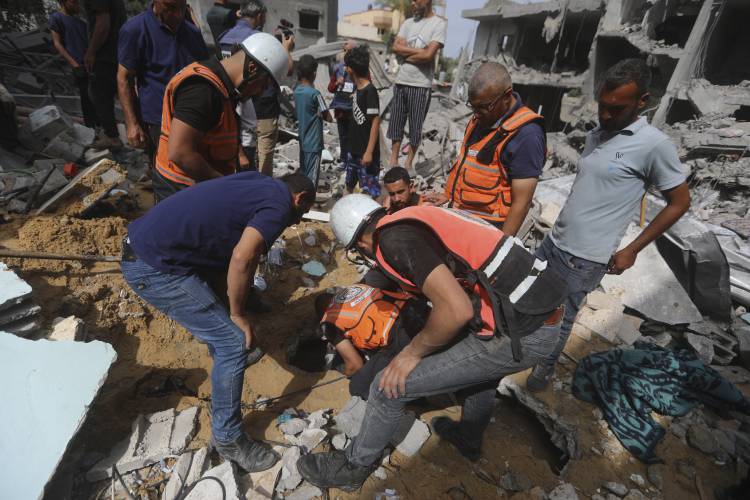 Palestinians displaced by the Israeli air and ground offensive on the Gaza Strip walk through a makeshift tent camp in Rafah, Gaza, Friday, May 10, 2024.
