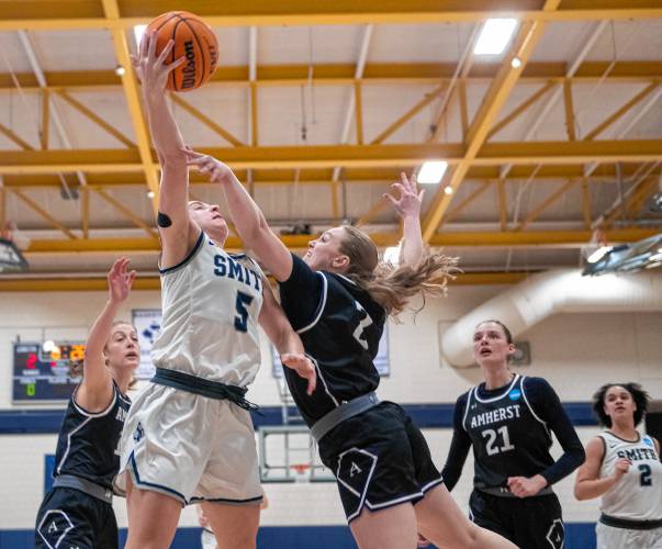 Smith guard Ally Landau (5) attempts a layup past Amherst guard Reagan Pahl (2) during the NCAA Division 3 Women's Basketball tournament Round of 32 game at Ainsworth Gym, Saturday.
