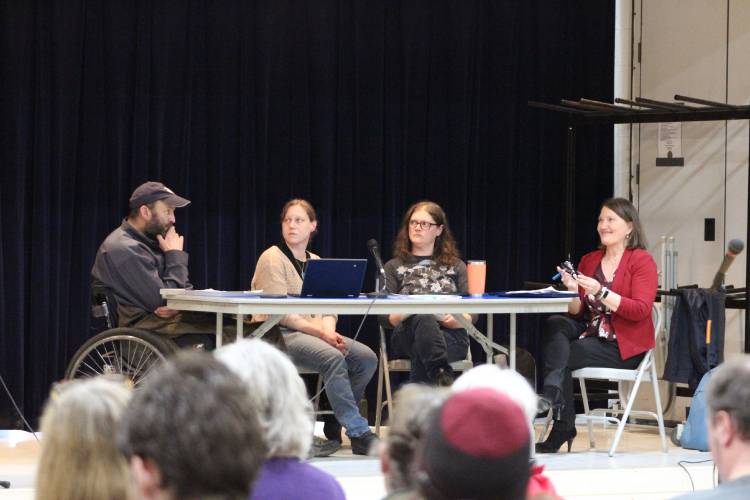 From left, Colrain Selectboard members Ben Eastman, Emily Thurber and Katie Korby, and Town Administrator Diana Parsons at Annual Town Meeting on Tuesday.