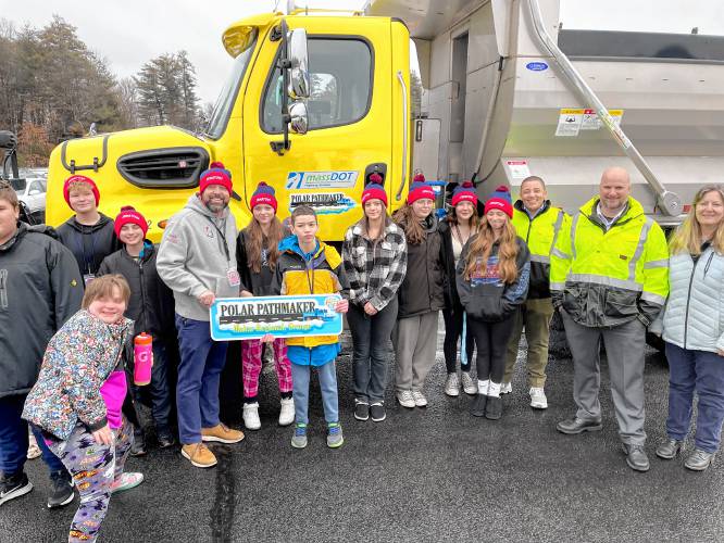 Representatives from the state Department of Transportation recently visited the winners of the second annual “Name a Snowplow” contest. Pictured is Kyle Magoffin’s seventh grade class at Ralph C. Mahar Regional School in Orange, which was declared a winner in District 2 with its entry, “Polar Pathmaker.”