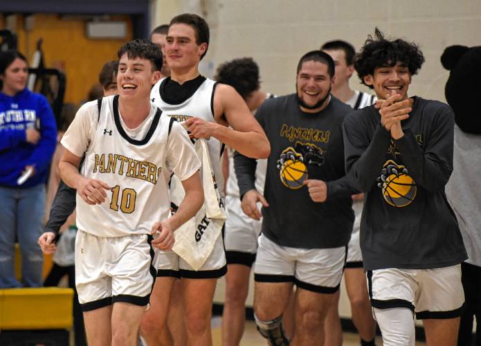 Pioneer’s Brayden Thayer (10) is all smiles after scoring the 1,000th point of his career during the Panthers’ 65-37 win over Fenway in the MIAA Division 5 Round of 32 on Friday night at Messer Gymnasium in Northfield.