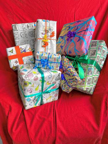 Wrapping papers from the 2023 Montague Reporter fundraiser. Artists from western Massachusetts and southern Vermont are invited to submit designs and proposals for wrapping paper pages in advance of the Sept. 1 deadline this year.