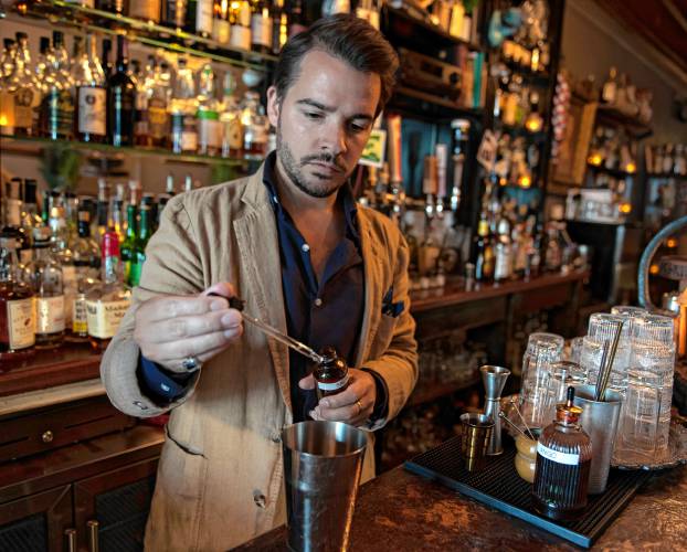 Ned King, bar manager of Gigantic in Easthampton, makes a drink called the Gem.