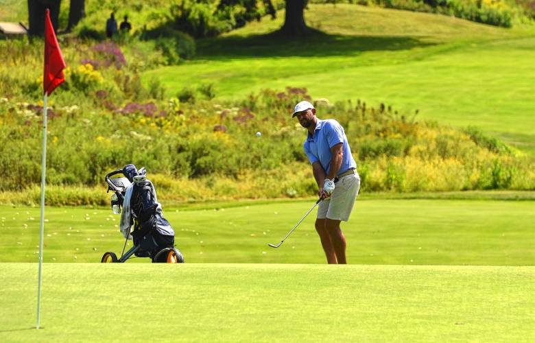 Brockton’s Matt Parziale chips onto the 18th green during qualifying for the 2025 U.S. Amateur Four-Ball Championship held at Orchards Golf Club in South Hadley on Monday.