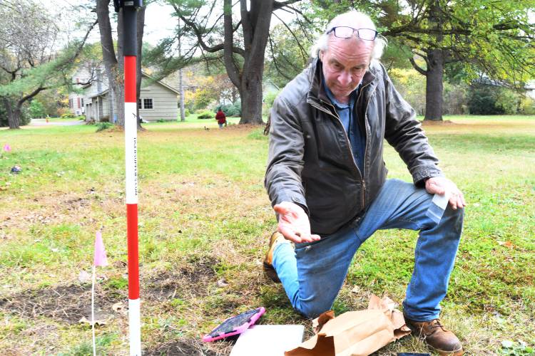 Chief Archaeologist Kevin McBride, of Berlin, Connecticut-based archaeological consulting group Heritage Consultants, searches a Meridian Street yard in Greenfield for musket balls and other evidence of battles in October 2023.