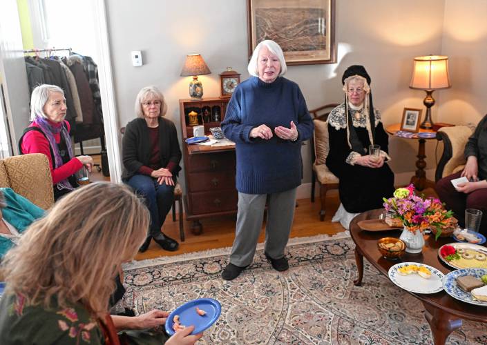 Host and former executive director at the Mary Lyon Foundation Susan Samoriski, standing, welcomes those at a celebratory luncheon in Shelburne Falls to mark the birthday of the late Mary Lyon.