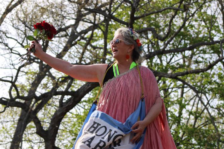 Marina Goldman stands tall in stilts at Peskeomskut Park ahead of the Turners Falls “International Labor Day Bread and Roses Parade and Rally” on Thursday.