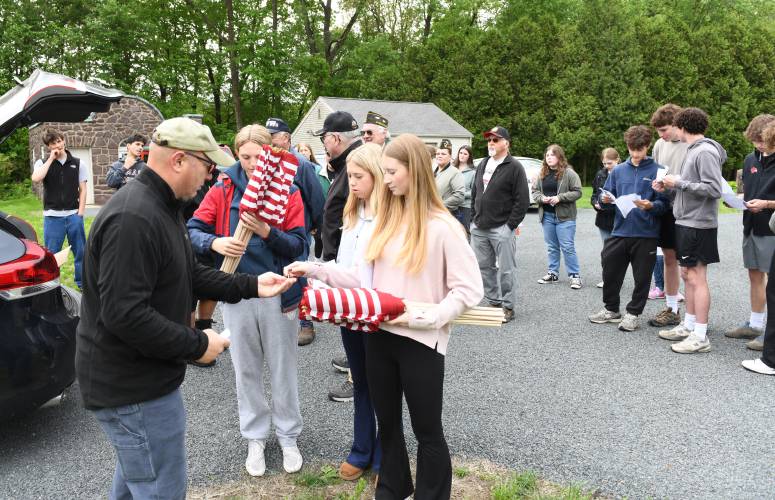 Members of Frontier Regional School’s National Honor Society chapter helped area veterans place flags at Brookside Cemetery and others in South Deerfield on Wednesday morning.