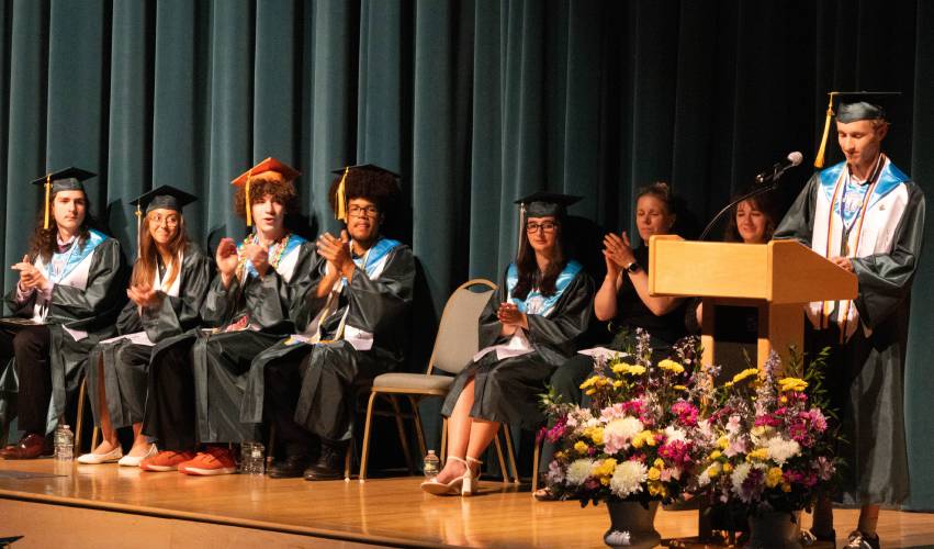 The Greenfield High School class of 2025 Valedictorian Shane Toomey speaks at his graduation on Saturday. On stage to his right are the officers of the class of 2025 and the class advisors.
