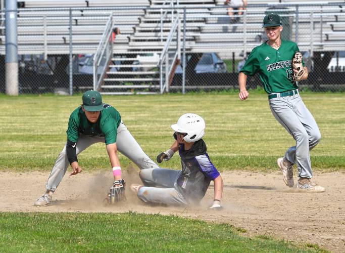 Greenfield’s Arthur Fitzpatrick is late with the tag as Westfield Tech’s Antonio Simpson takes second with Greenfield’s Caleb Thomas backing up the play during a MIAA Div. 5 Round of 16 game at Veterans Field in Greenfield on Tuesday. 
